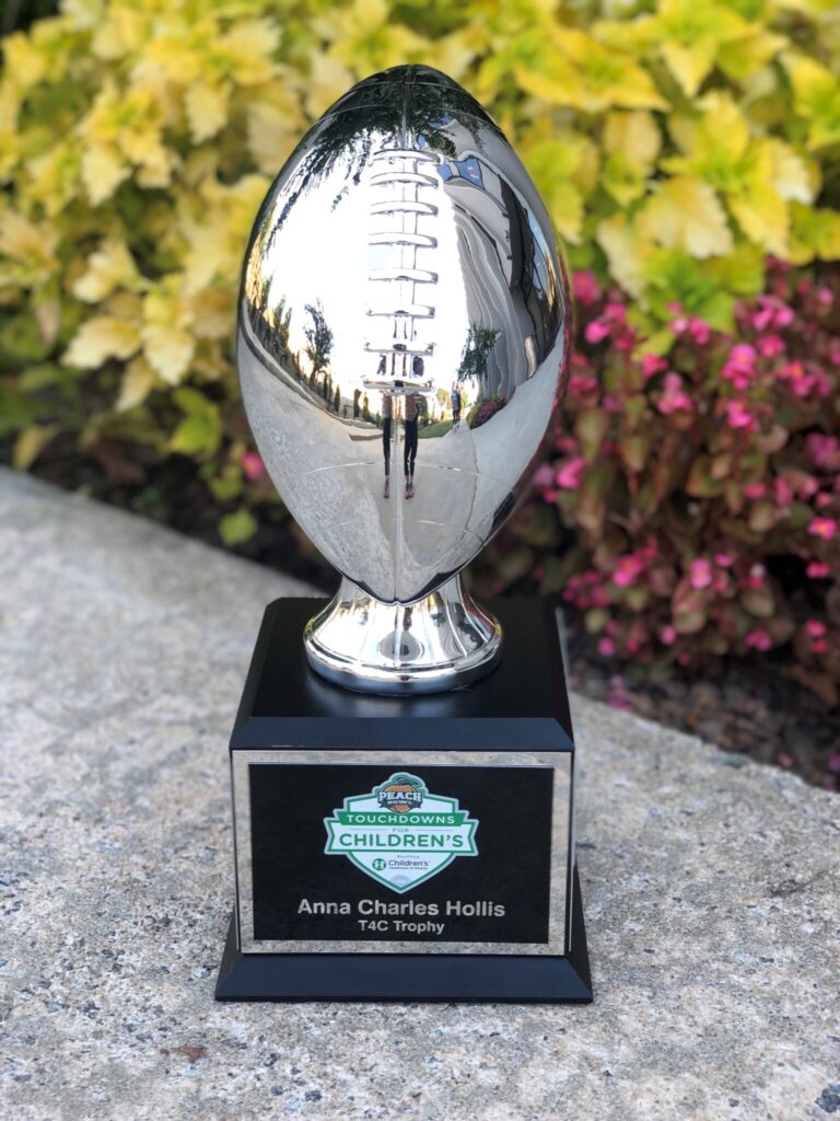 ACH Trophy A silver football on a black, square trophy stand